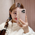 Silicone phone case with rhinestone pearl bracelet for iPhone Pro Max in pink and white options