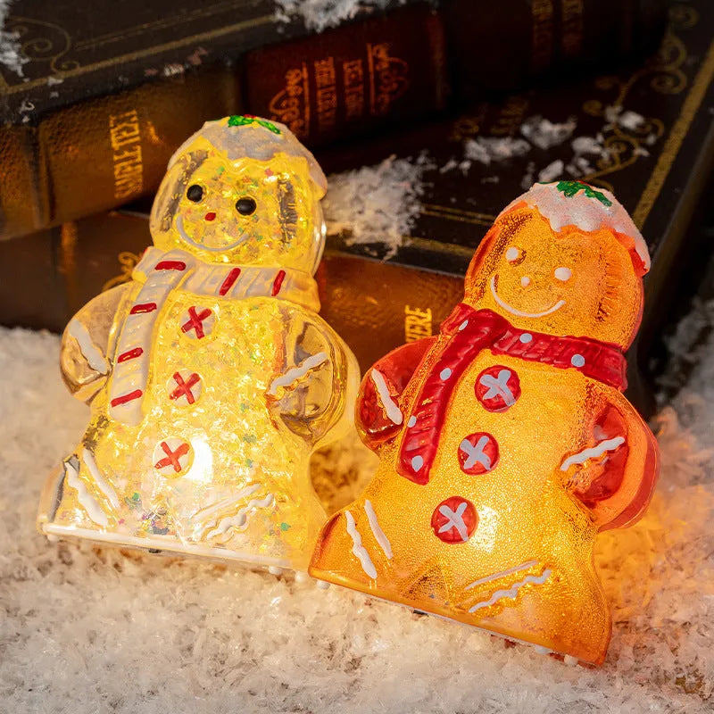 Set of four glowing plastic gingerbread man Christmas ornaments with red, white, and transparent scarves on a festive background.