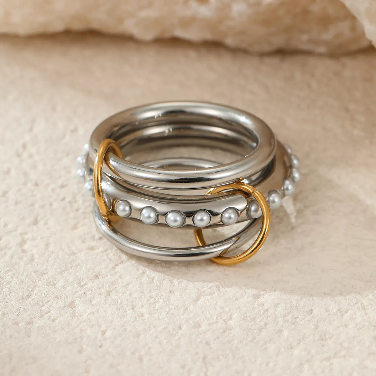 Stacked colour matching stainless steel ring with 18K gold plating and exaggerated design