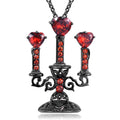 Women's retro candlestick pendant necklace on a gothic cross chain.