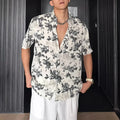 Loose fit floral printed short sleeve shirt in white or black with pendant-style front