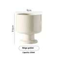 Hand-pinched ceramic mug with irregular shape and solid-colour finish, approximately 14.5cm tall