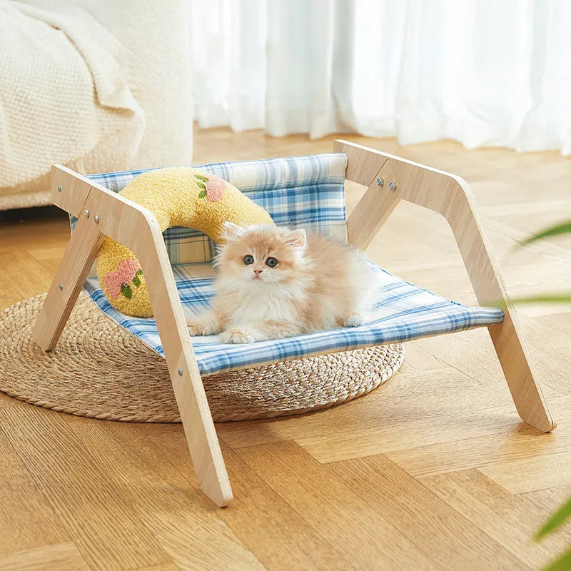Wooden frame elevated cat bed with cloth hammock in beach chair design for indoor cats