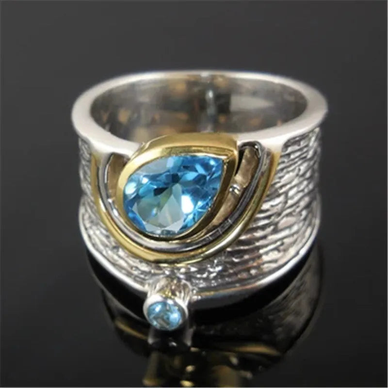 Blue Chinese style zircon ring with rhinestone detailing and drop shape on alloy band