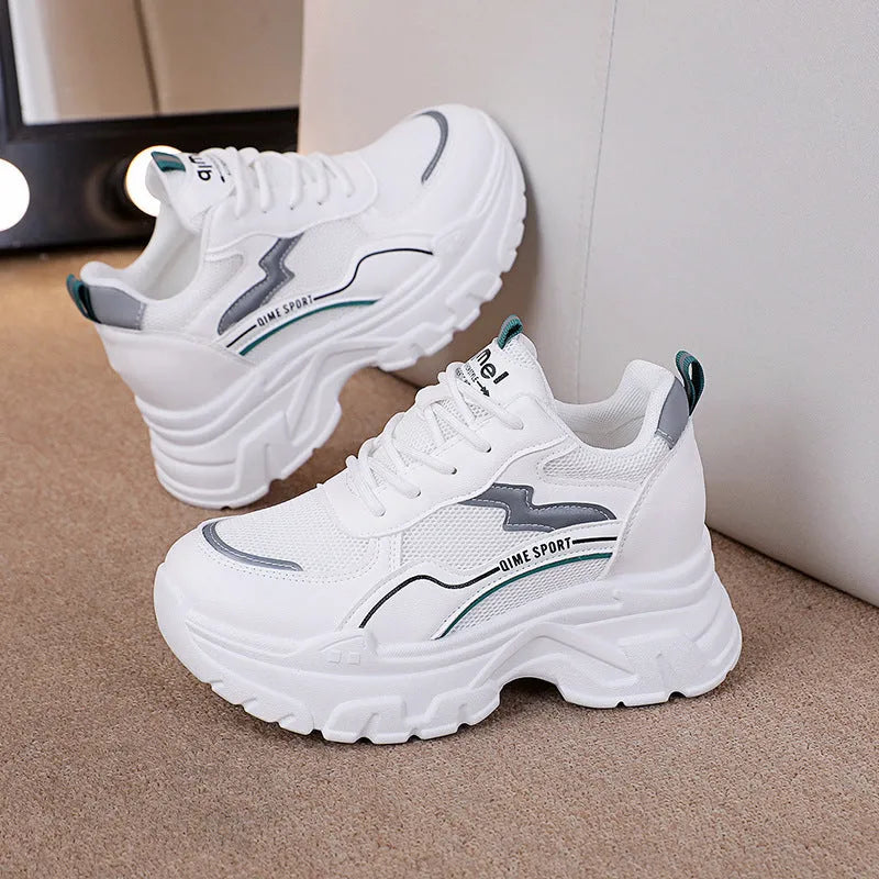 White women's dad shoes with cross straps, lace-up front, and a breathable mesh upper.