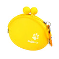 Yellow silicone dog treat waist bag with hook and loop closure, shown next to dog treats.