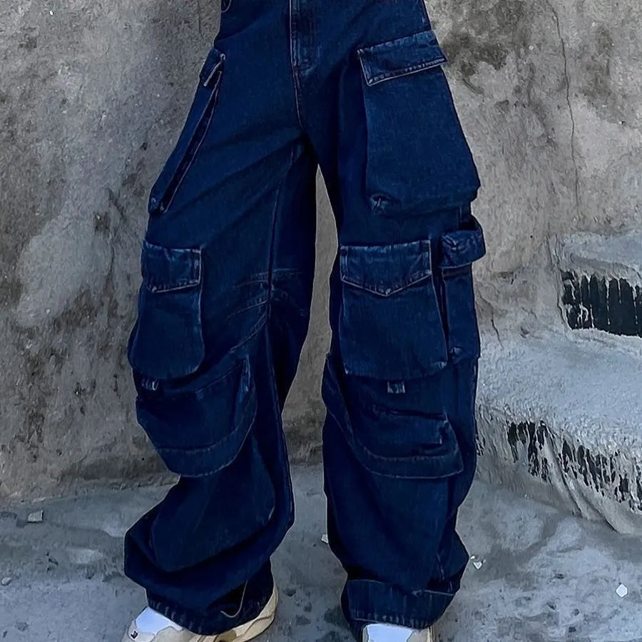 Dark blue distressed wide-leg denim jeans with high waist and multiple pockets laid flat.