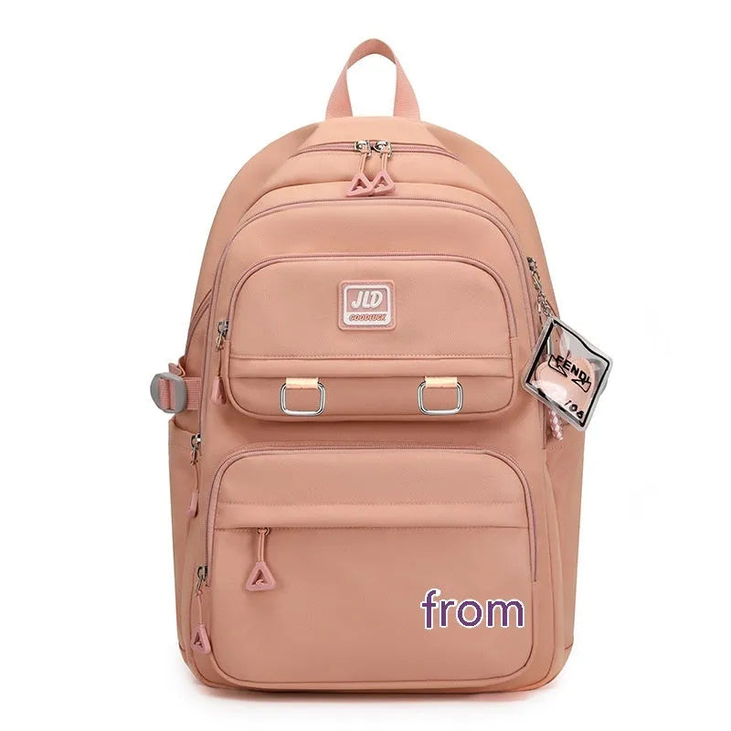 Purple and geometric design girls large capacity nylon backpack with curved backpanel.