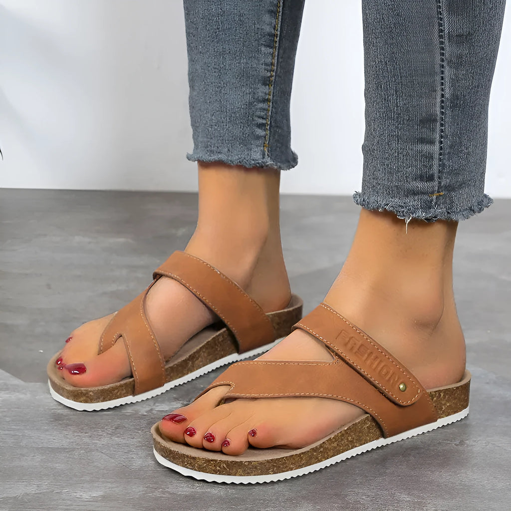 Women's flat toe ring flip-flops with a thick foam sole, shown in a solid colour.