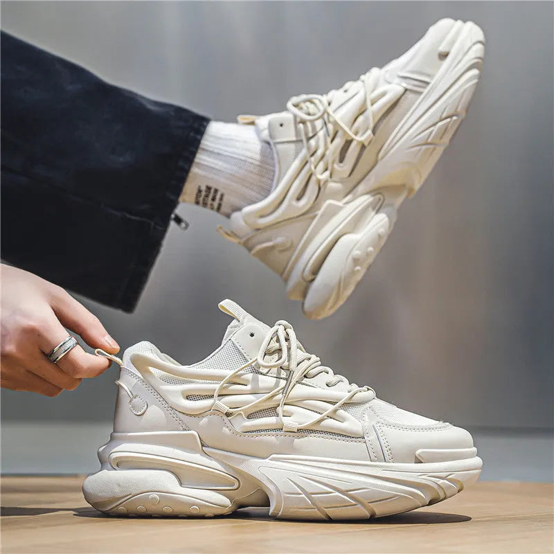 Men's low-top sneaker in beige with mesh PU leather upper, lace-up front, and a platform rubber sole.