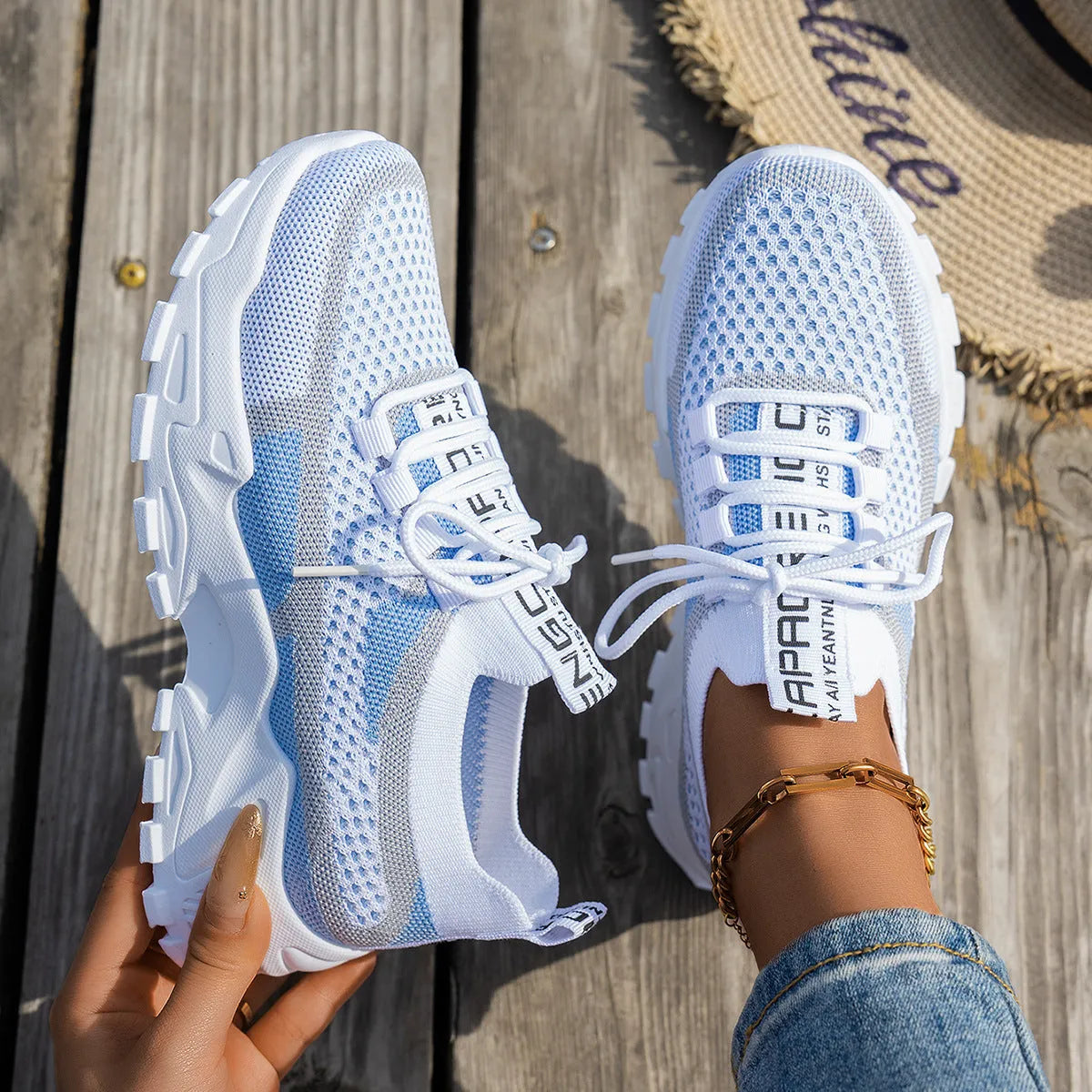 Women's Flyknit mesh lace-up sneakers in various colours with low flat heel and rubber sole