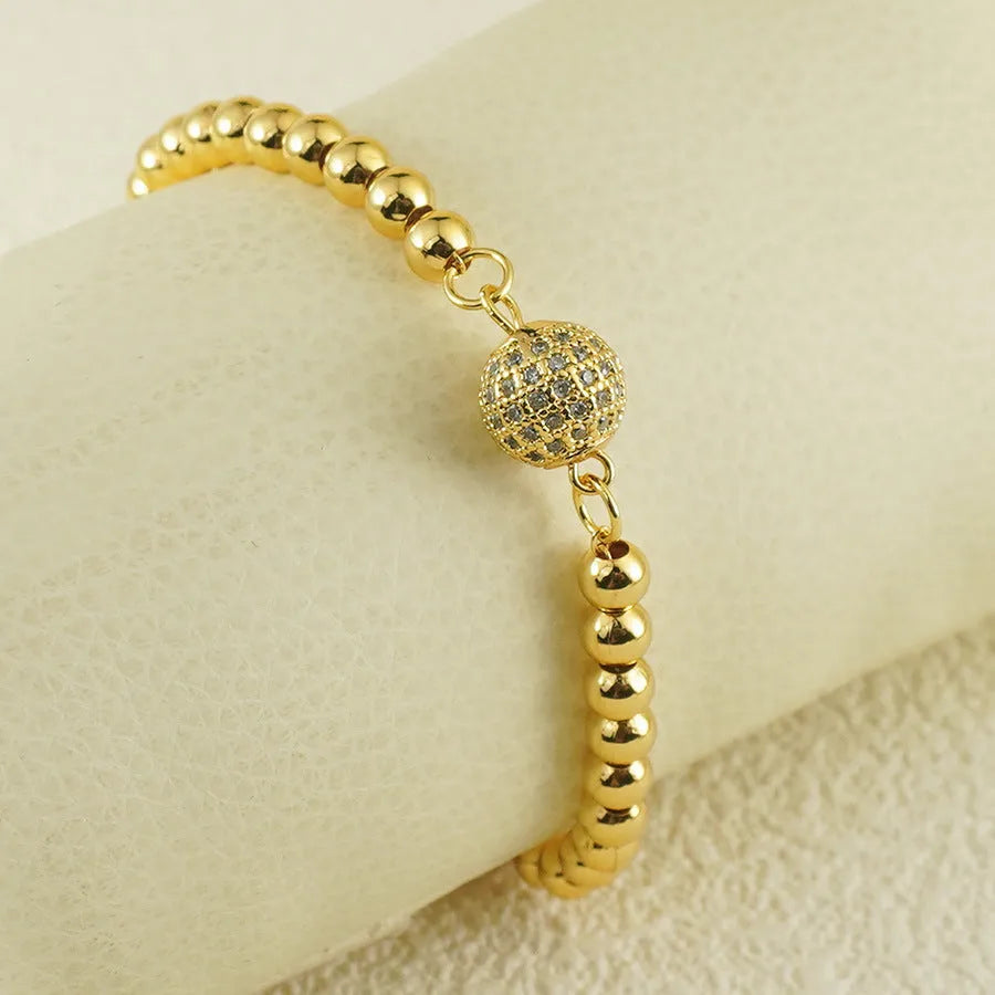 Women's heart-shaped copper bracelet with a single round zircon stone.