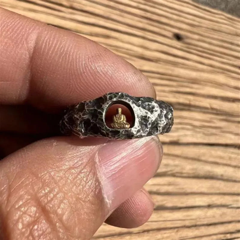 Hand-forged copper Buddha ring with rock texture finish showing grotto design