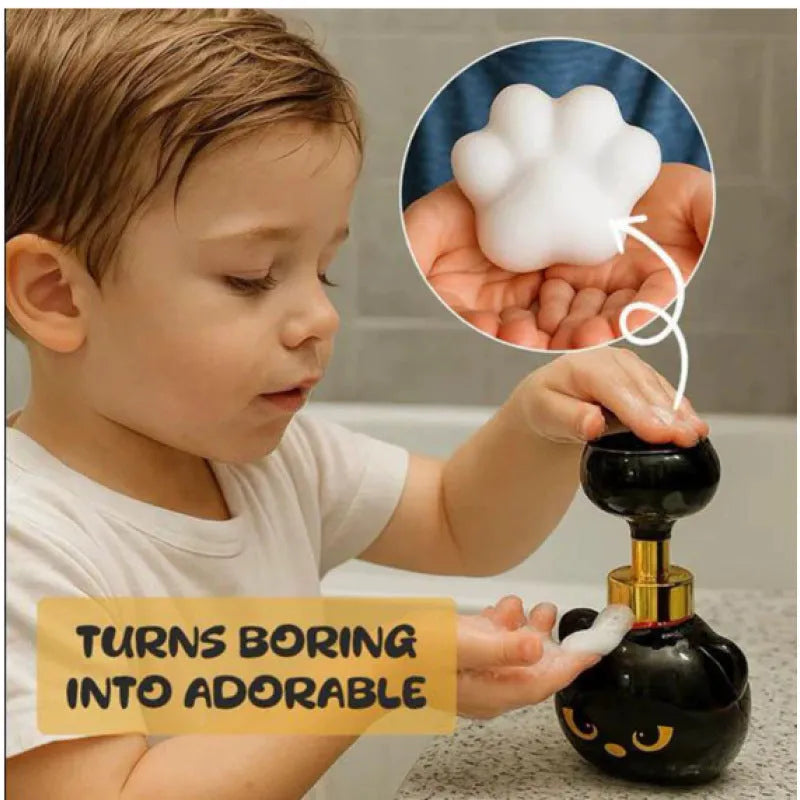 Black cartoon cat shaped plastic soap dispenser with manual pump, 10cm wide by 18cm high