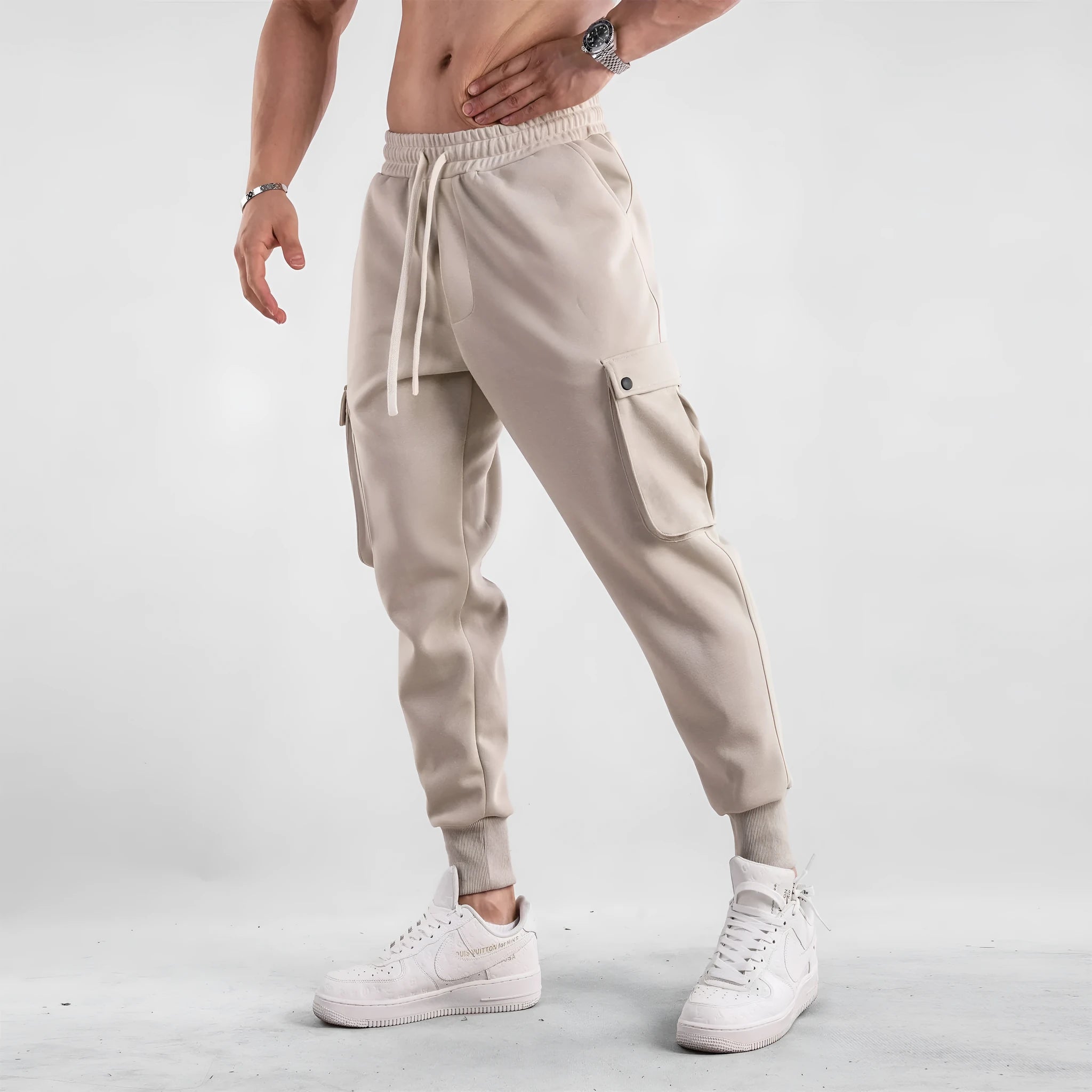 Men's loose cotton sports trousers with ankle-tied cuffs in solid colours