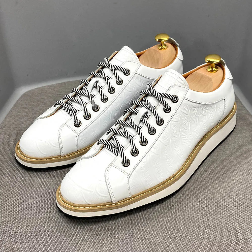 Men's low-top handmade lace-up shoes with an embossed pattern on the upper, shown in a choice of colours.