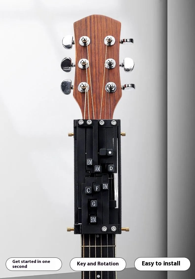 Black automatic guitar chord practice device for novice players on a folk guitar.
