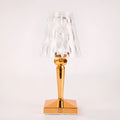 Rose gold portable touch night light on a surface, showing its acrylic body and modern design.