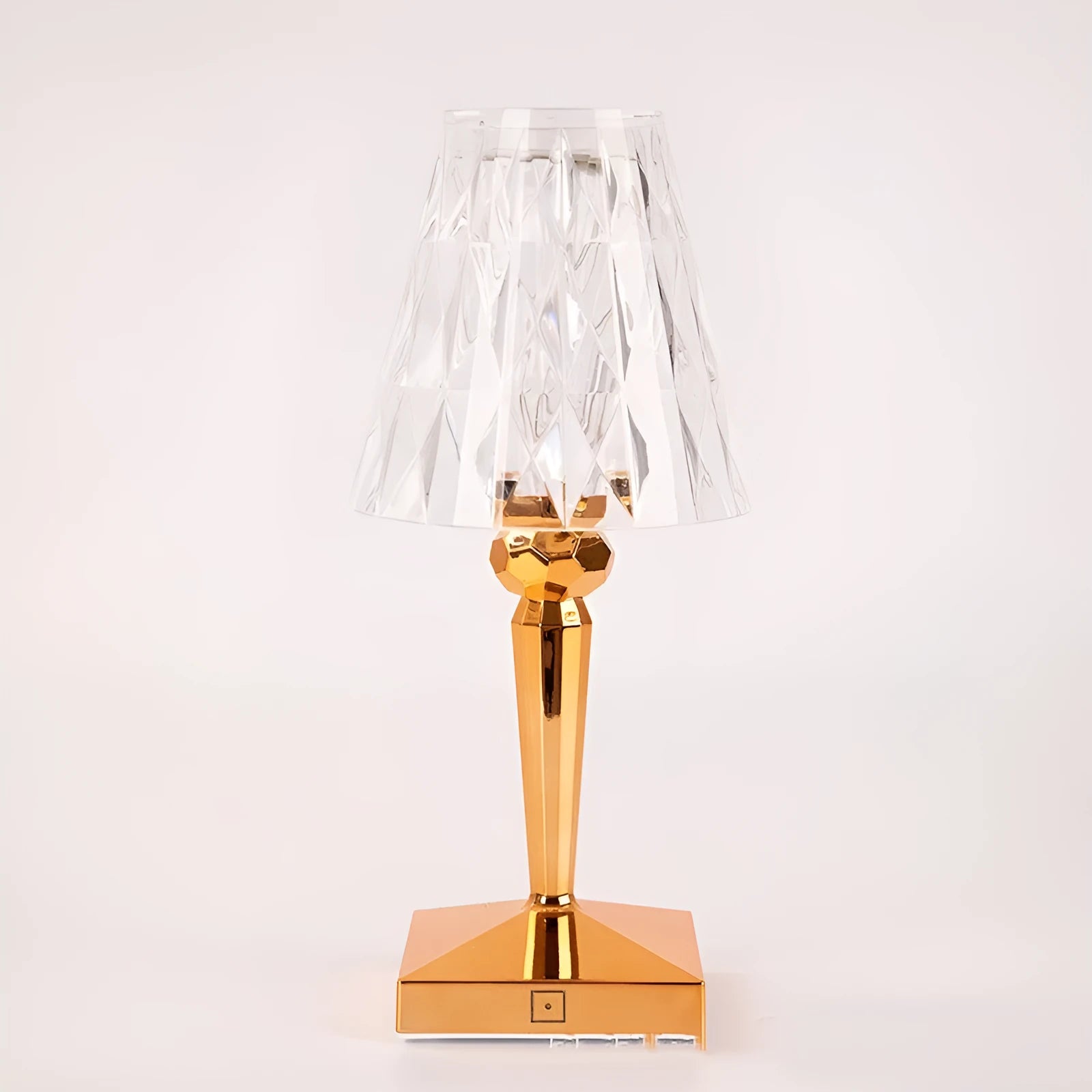 Rose gold portable touch night light on a surface, showing its acrylic body and modern design.