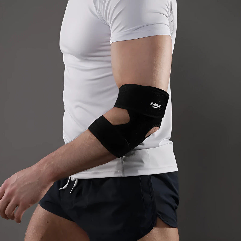 Black adjustable sports elbow guard shown on an arm.