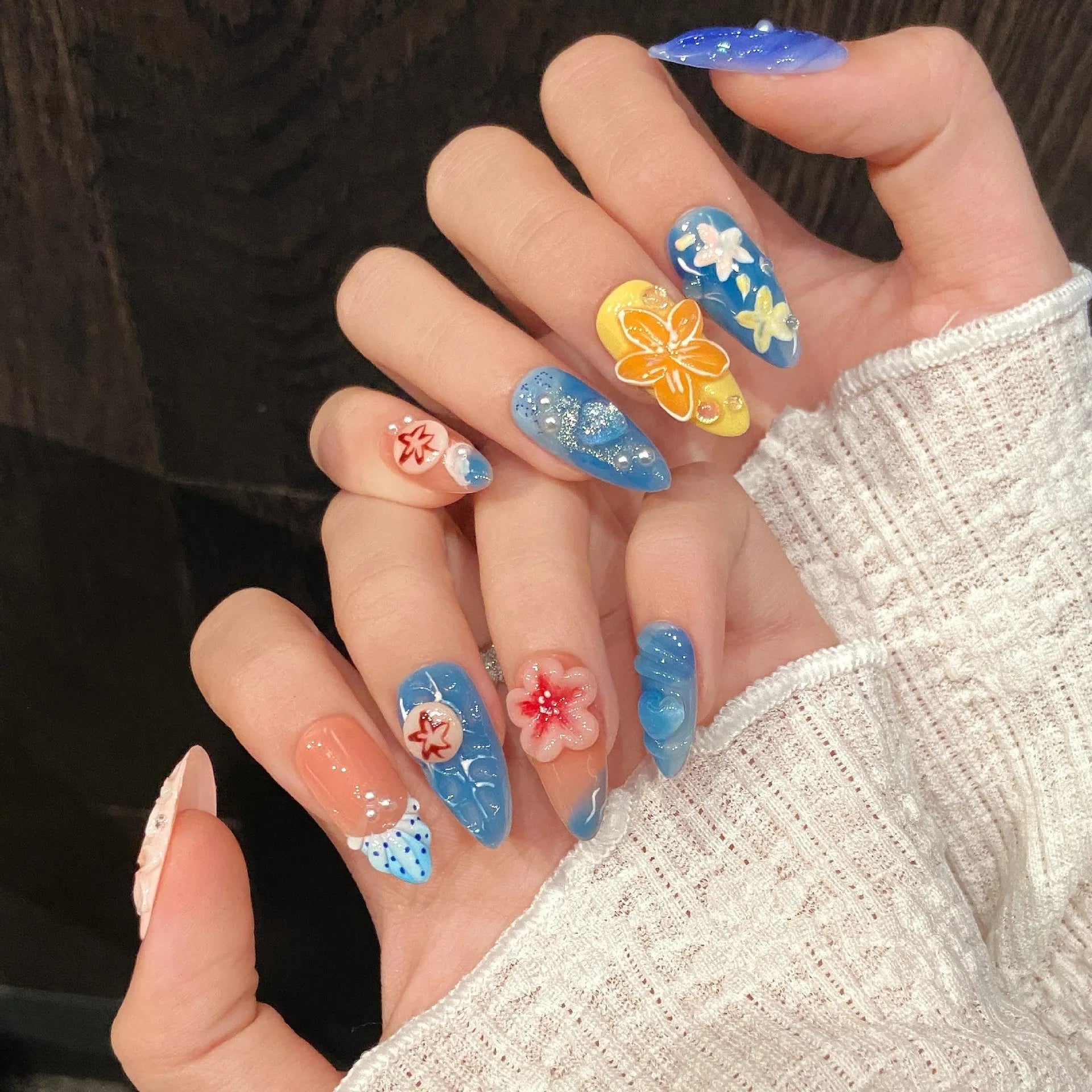 Three-dimensional carved jellyfish design on plastic wearable armour in almond nail colour