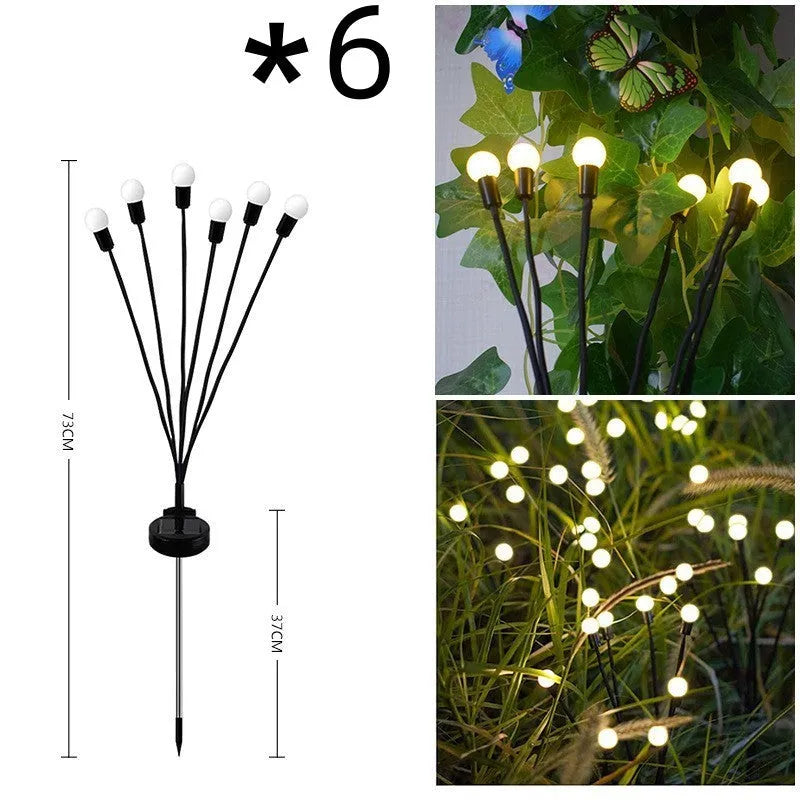 Solar-powered LED garden ground light with multiple LED heads and a stainless steel ground spike.