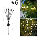 Solar-powered LED garden ground light with multiple LED heads and a stainless steel ground spike.