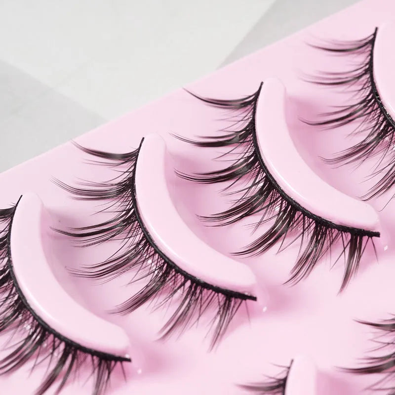 Set of three styles of black manga false eyelashes on plastic packaging