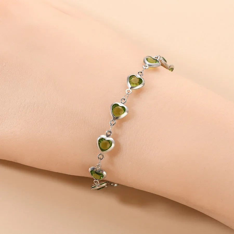 Devil's Eye geometric heart-shaped stainless steel bracelet in one of six colour options on a wrist.
