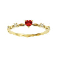 Gold electroplated copper ring with a peach heart charm and set zircon stone.