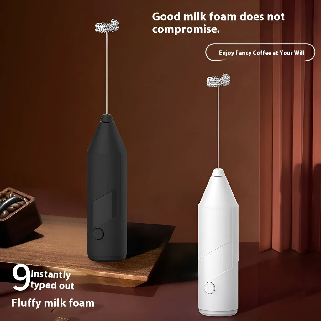 Handheld USB rechargeable milk frother in black, white, or khaki colour on a kitchen counter.