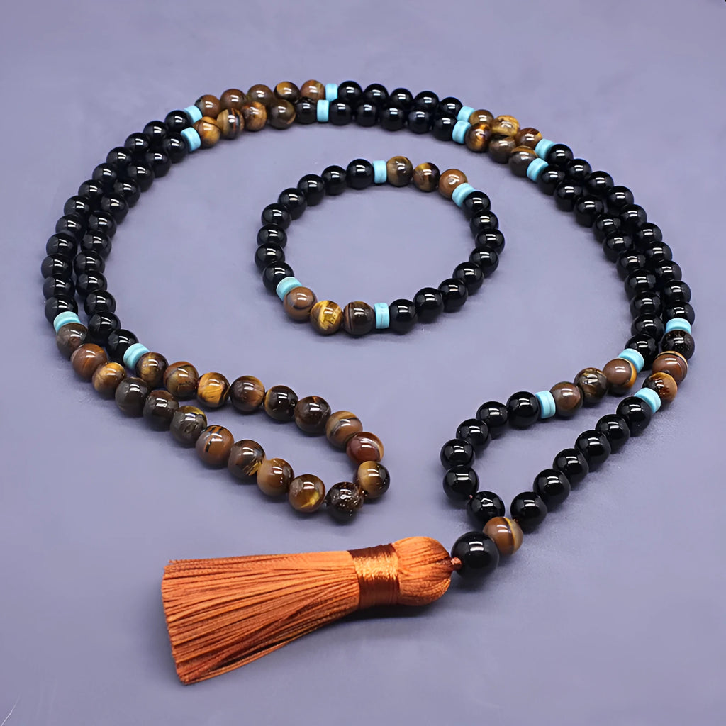 Black agate jewellery set showing tiger-eye stone necklace and geometry bead bracelet