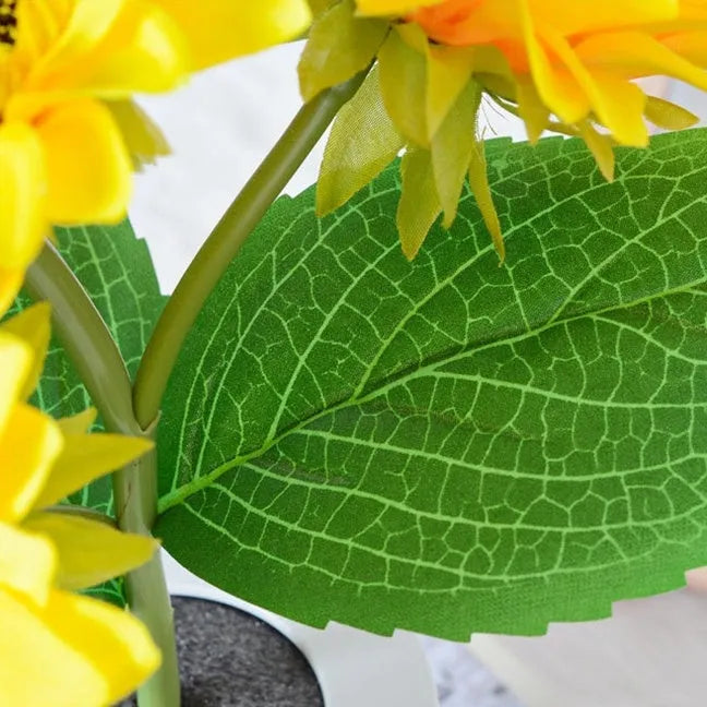 Rechargeable sunflower simulation LED night light table lamp with artificial flowers on a wooden table