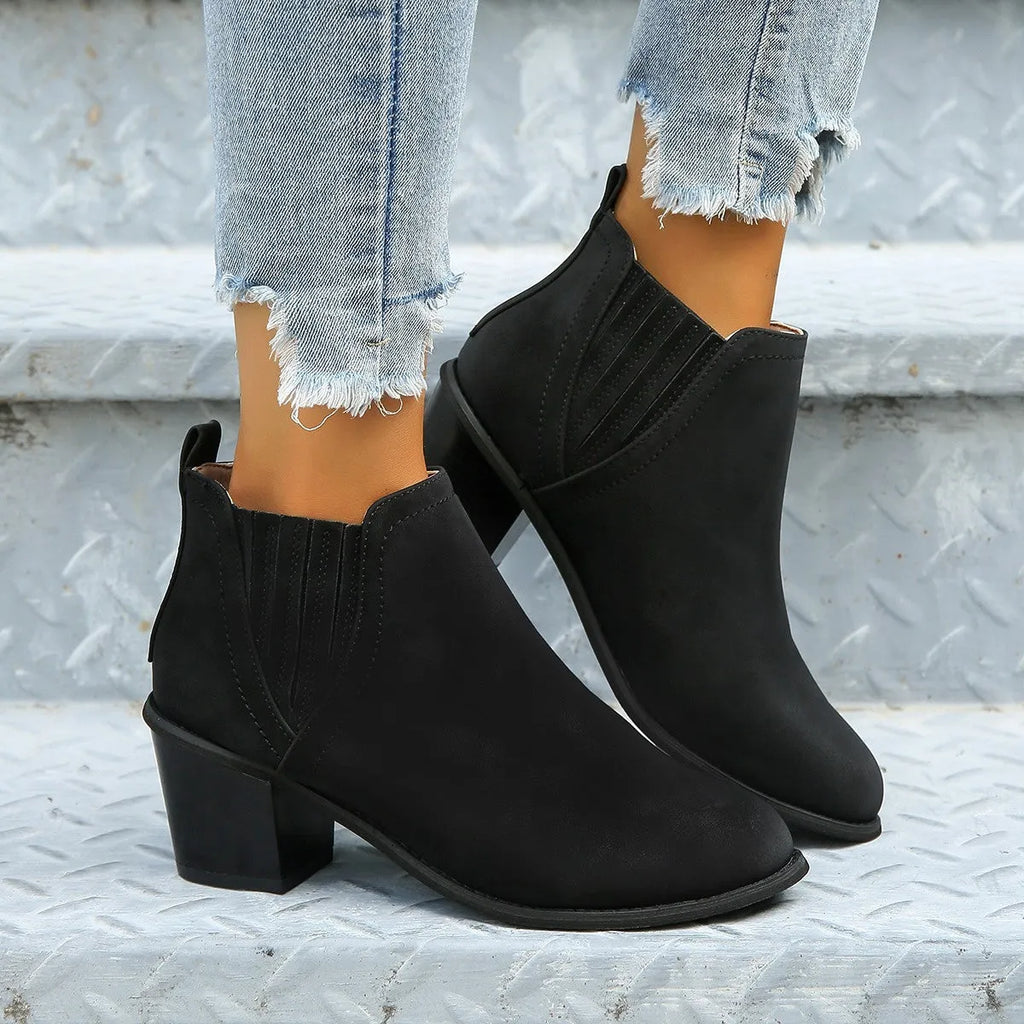 Women's black slip-on ankle boots with pointed toe and thick square heel
