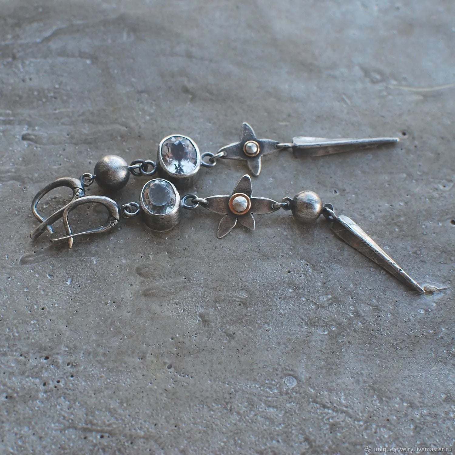 Geometric XINGX pendant earrings with antique silver finish and rhinestone detailing