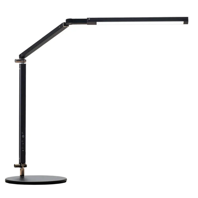 Aluminium LED desk lamp with clip base and remote control on a wooden desk.