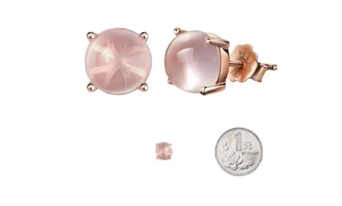 Rose gold coloured drop-shaped stud earrings with a synthetic ross quartz crystal inlay