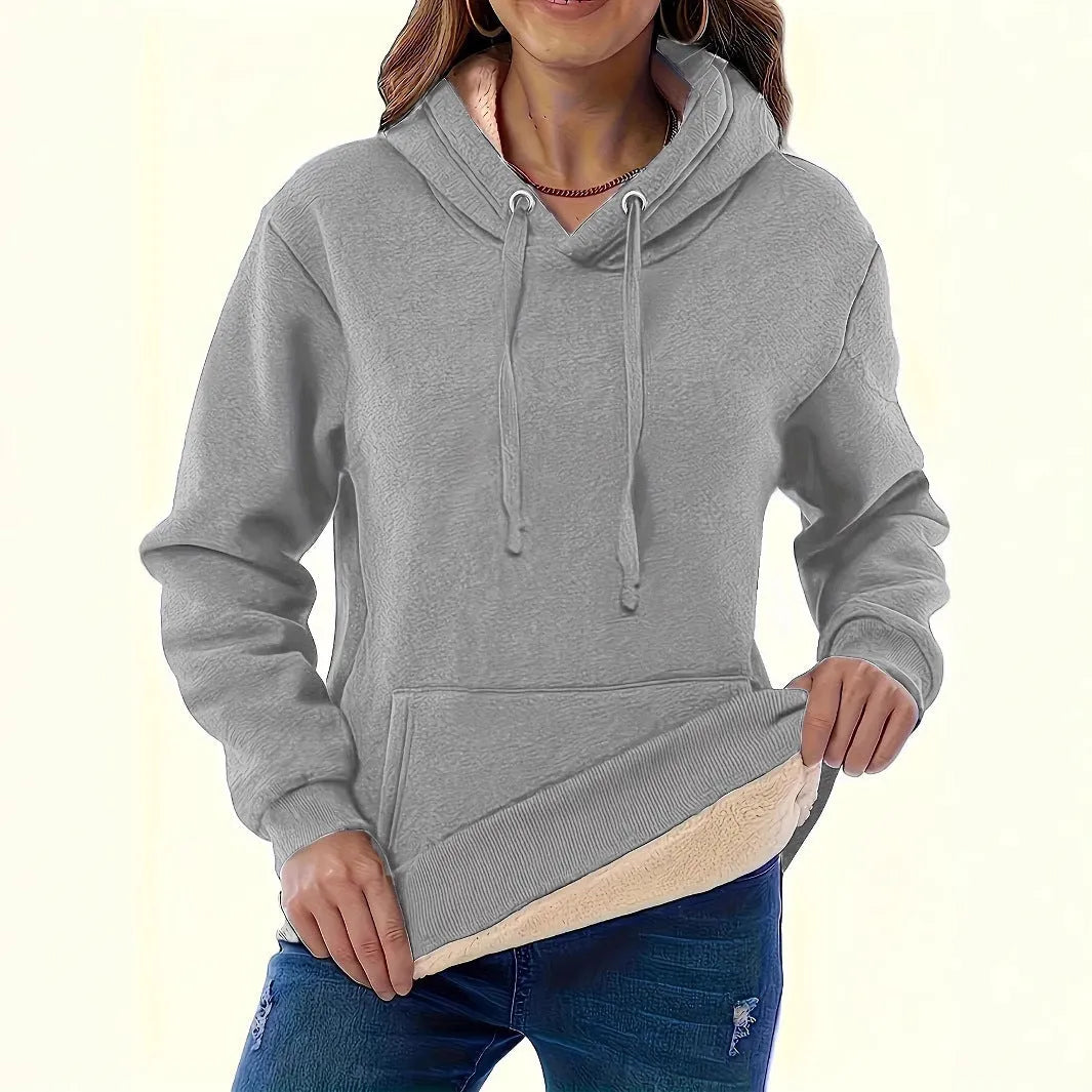 Women's black hooded sweater with a raised 3D pattern, featuring a loose fit and long sleeves.