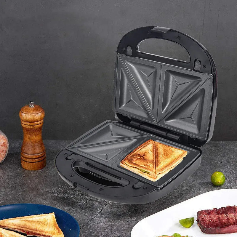 Black electric sandwich pan with double-sided heating, non-stick coating, and brushed stainless steel top cover