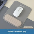 Ergonomic mouse pad with built-in wrist rest in various colour options on a desk
