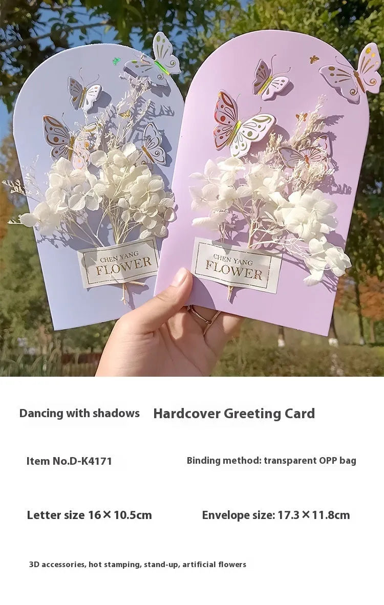 Handmade 3D butterfly-shaped birthday card with artificial flowers and hot foil stamping details.