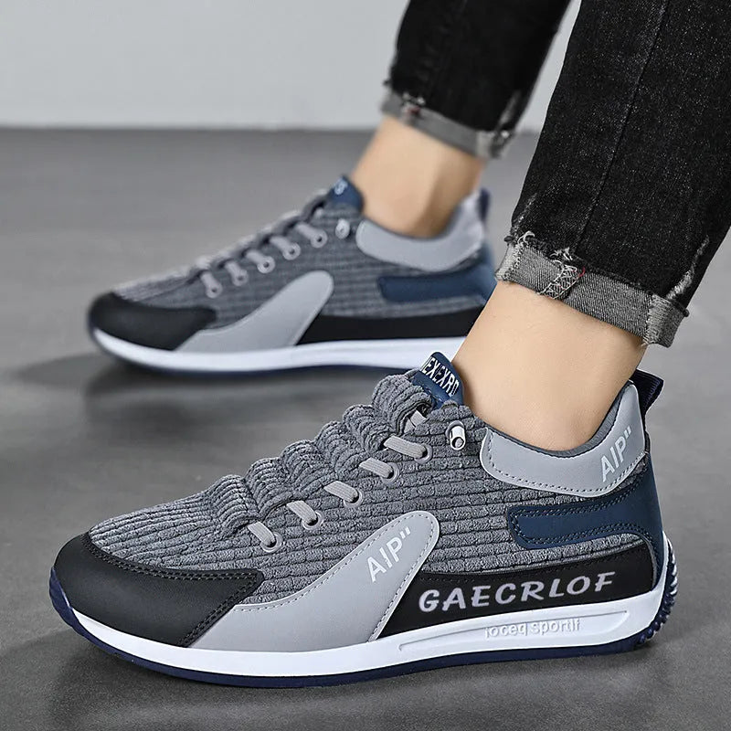Men's green and grey mesh running shoes with round toe design and front lace-up closure