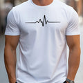 Man wearing a loose fit grey T-shirt with a 3D sports letter design on the front.