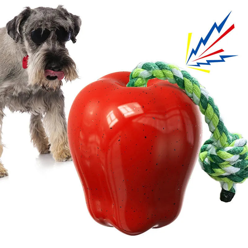 Green Apple-shaped dog toy with dropping ball mechanism for food reward chewing activity