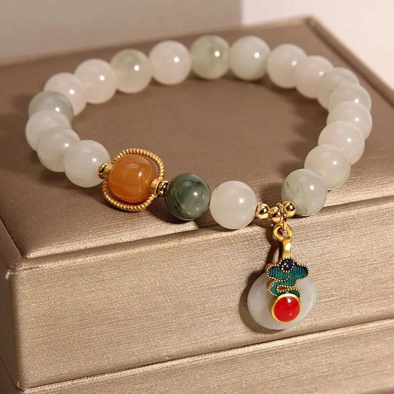 Women's ice jade bracelet with xiangyun peace pattern and pearl accents