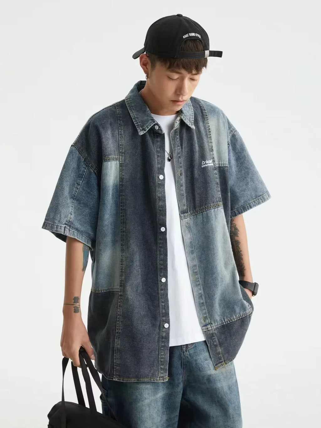 Blue men's loose-fit denim shirt with Japanese retro wash and stitching details, shown open as a cardigan.
