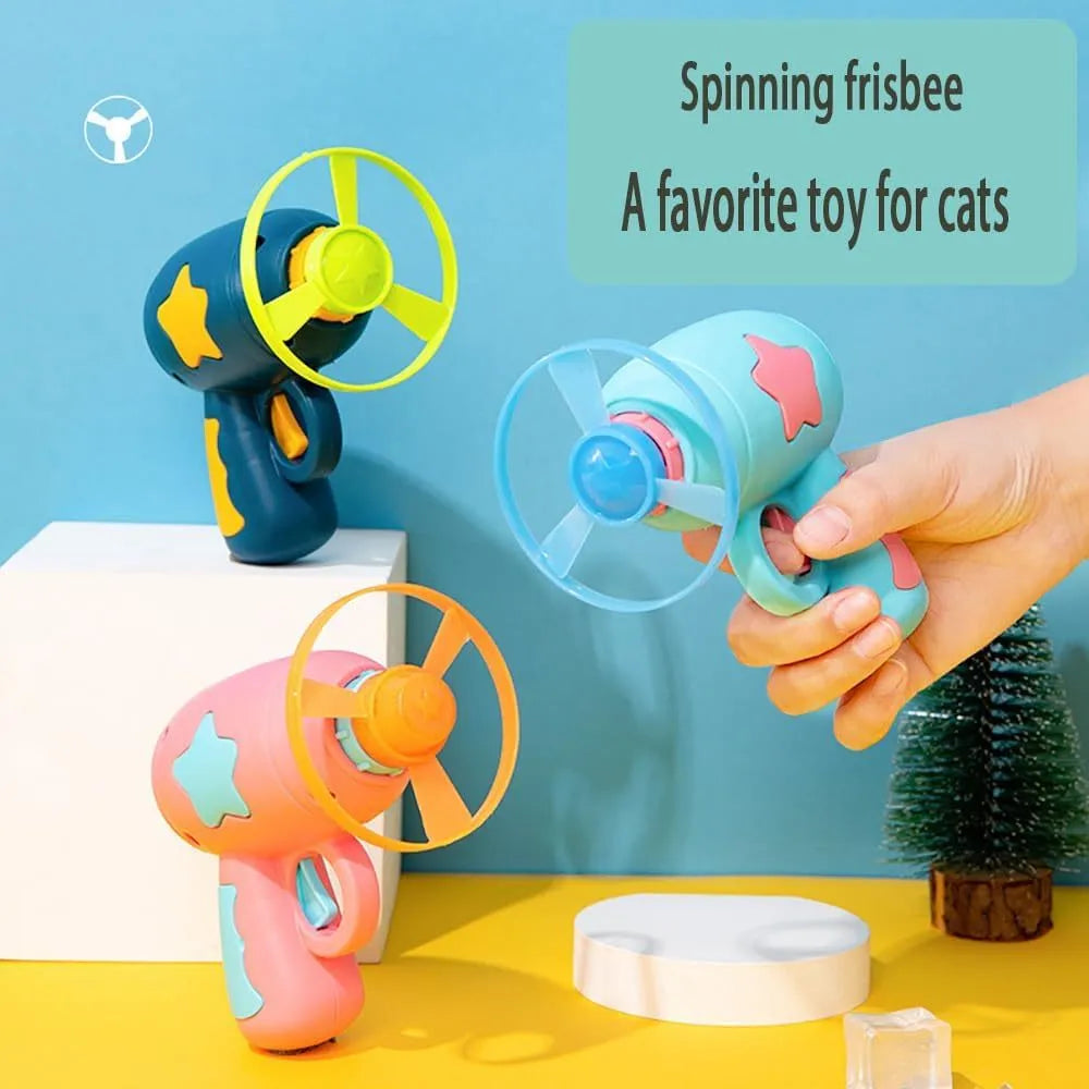 Blue and pink plastic cat toy gun with frisbee measuring 11cm for indoor feline play