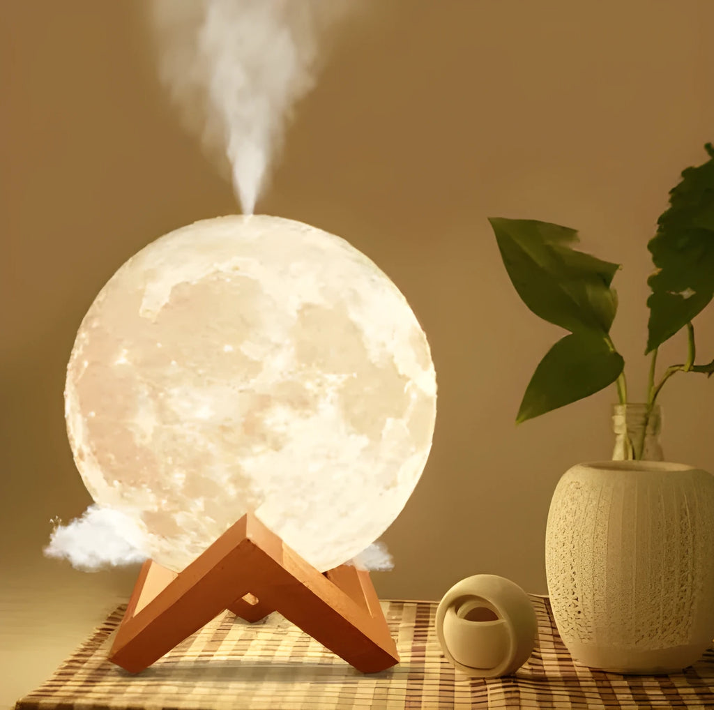 Spherical white Lunar humidifier night light with USB charging port and essential oil bottle