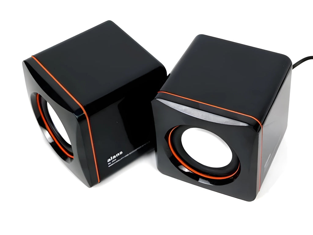Black square USB-powered 2.0 mini desktop computer speakers on a desk