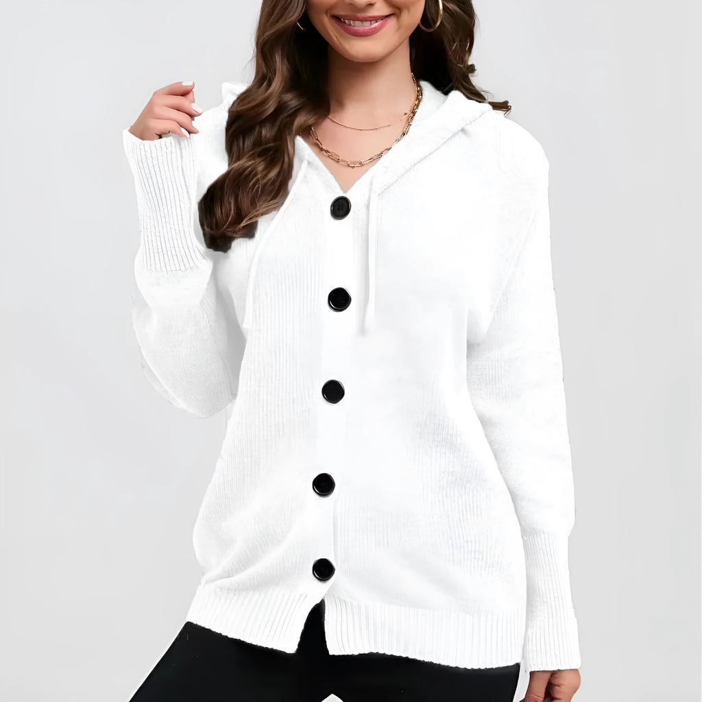 A woman wearing a loose-fit, hooded, solid-colour cotton cardigan sweater in a neutral tone.